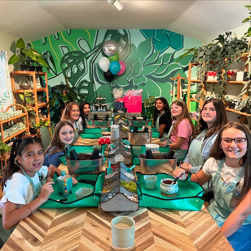 Guests celebrating a birthday with a planting workshop at the Sincerely Succulents potting bar